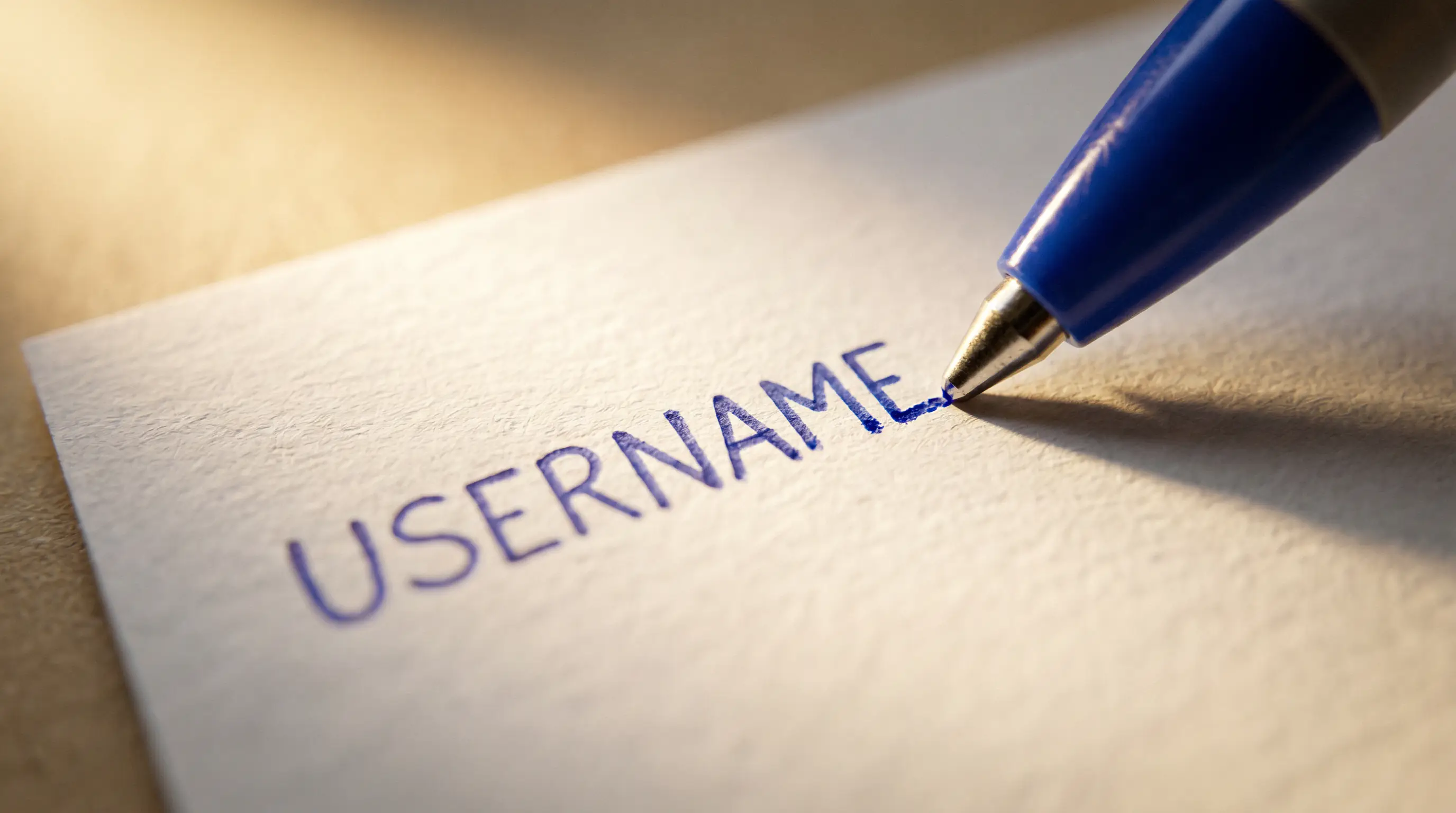 Ballpoint pen writing block letters on postcard for sweepstakes AMOE submission showing clear account identifier handwriting