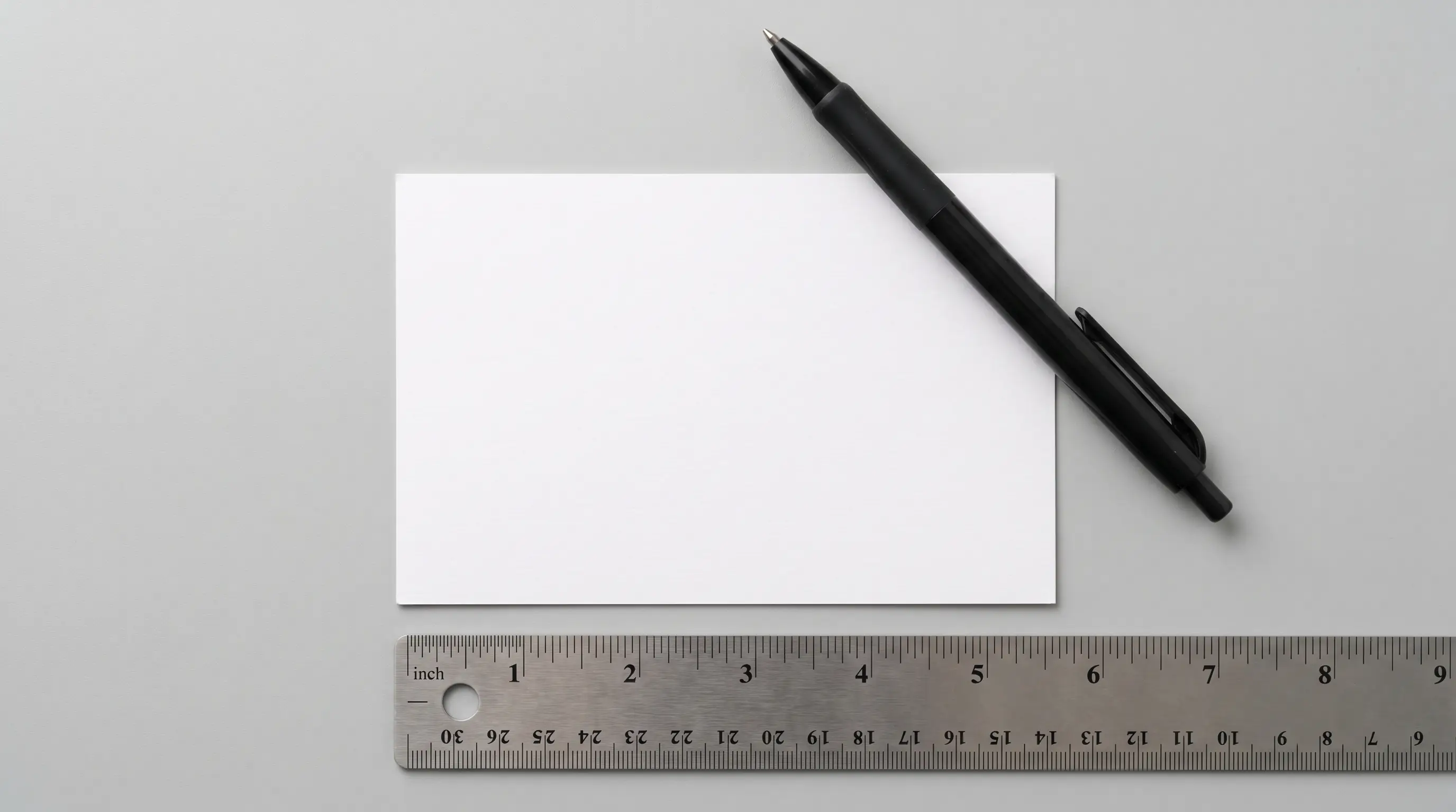 Standard USPS postcard dimensions laid out on a desk alongside a pen for handwriting an AMOE sweepstakes request